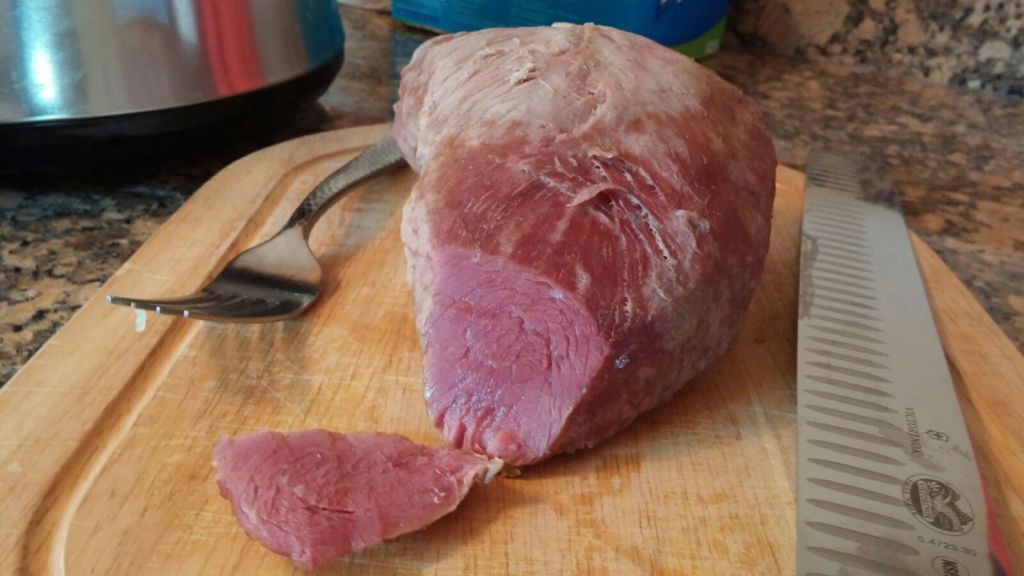 Perfectly cooked corned beef on a cutting board